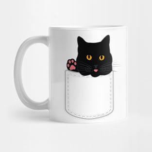 Cute black cat looks out of pocket and shows paw Mug